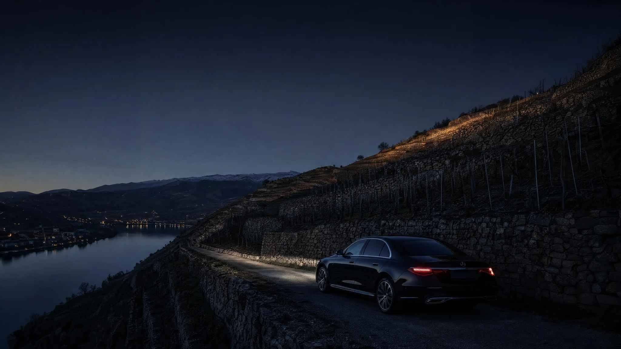 The Côte-Rôtie terraces above the Rhône, a Mercedes S-Class on the wine road.